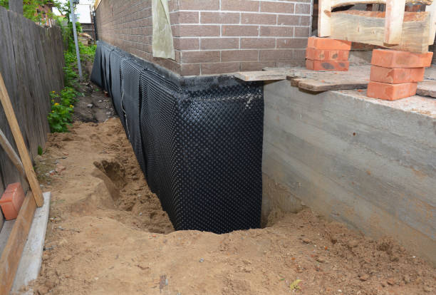 Happy homeowners after waterproofing job in Westphalia